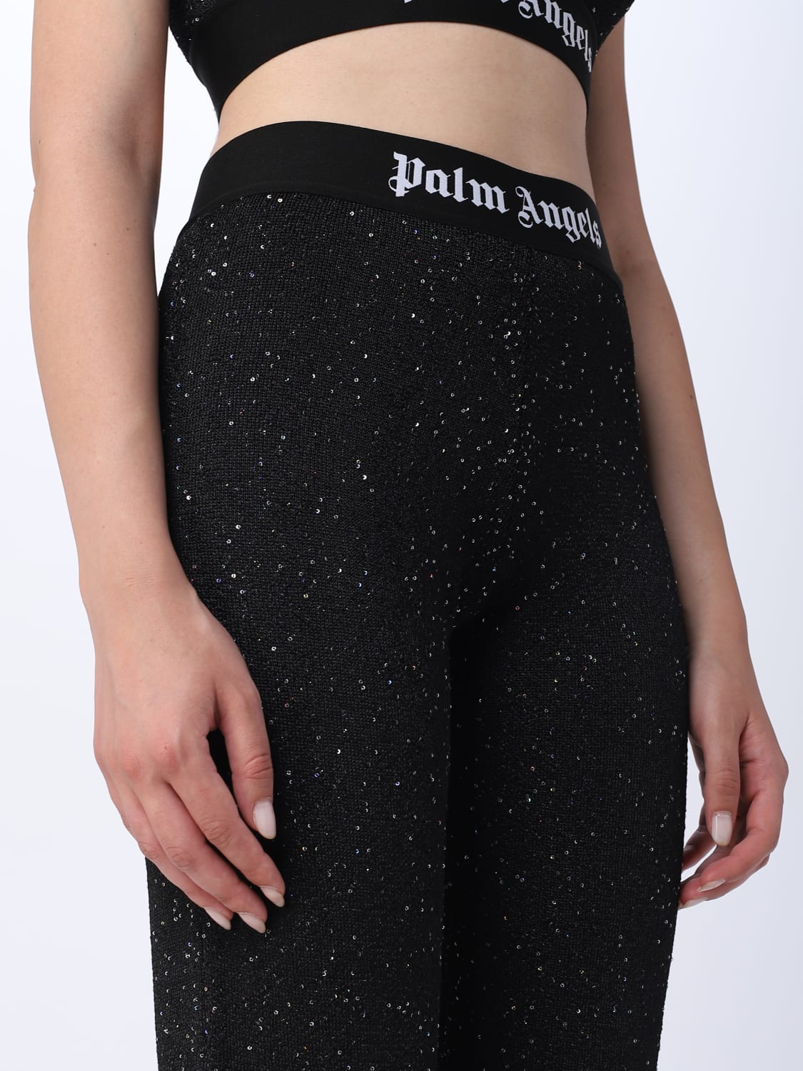 PALM ANGELS: trousers in stretch fabric with sequins - Black
