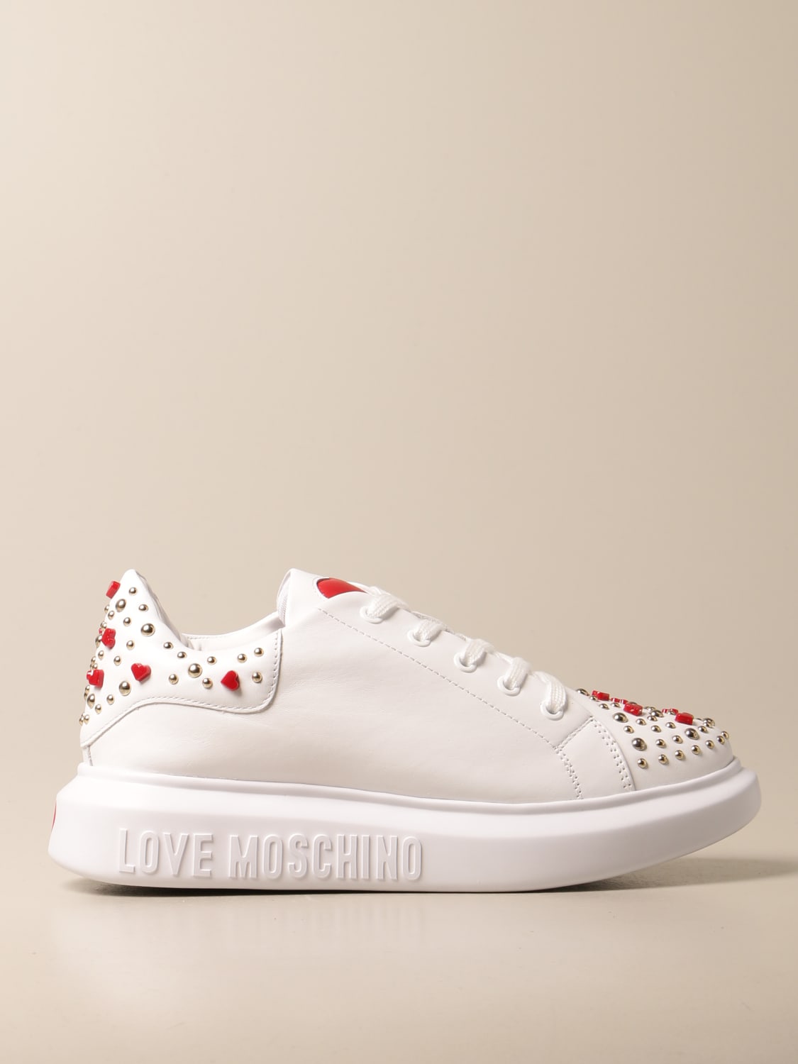 LOVE MOSCHINO: sneakers in leather with hearts and studs - White