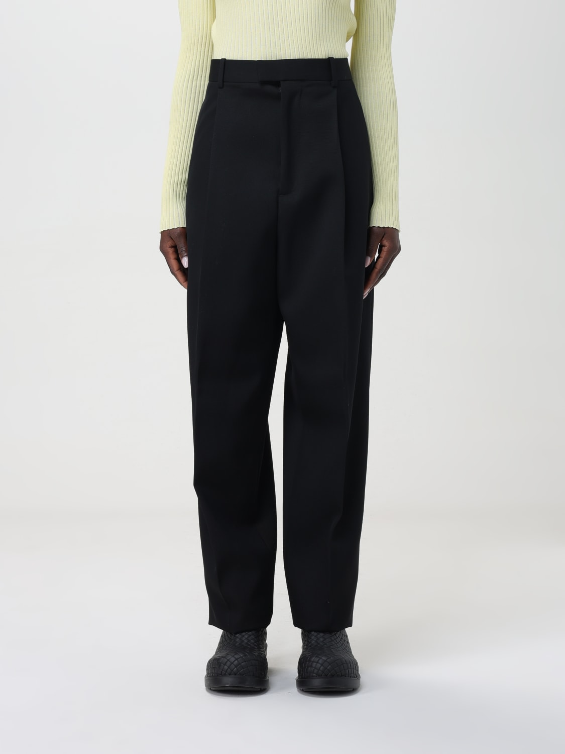 Bottega Veneta® Women's Curved Shape Wool Pants in Black. Shop online now.