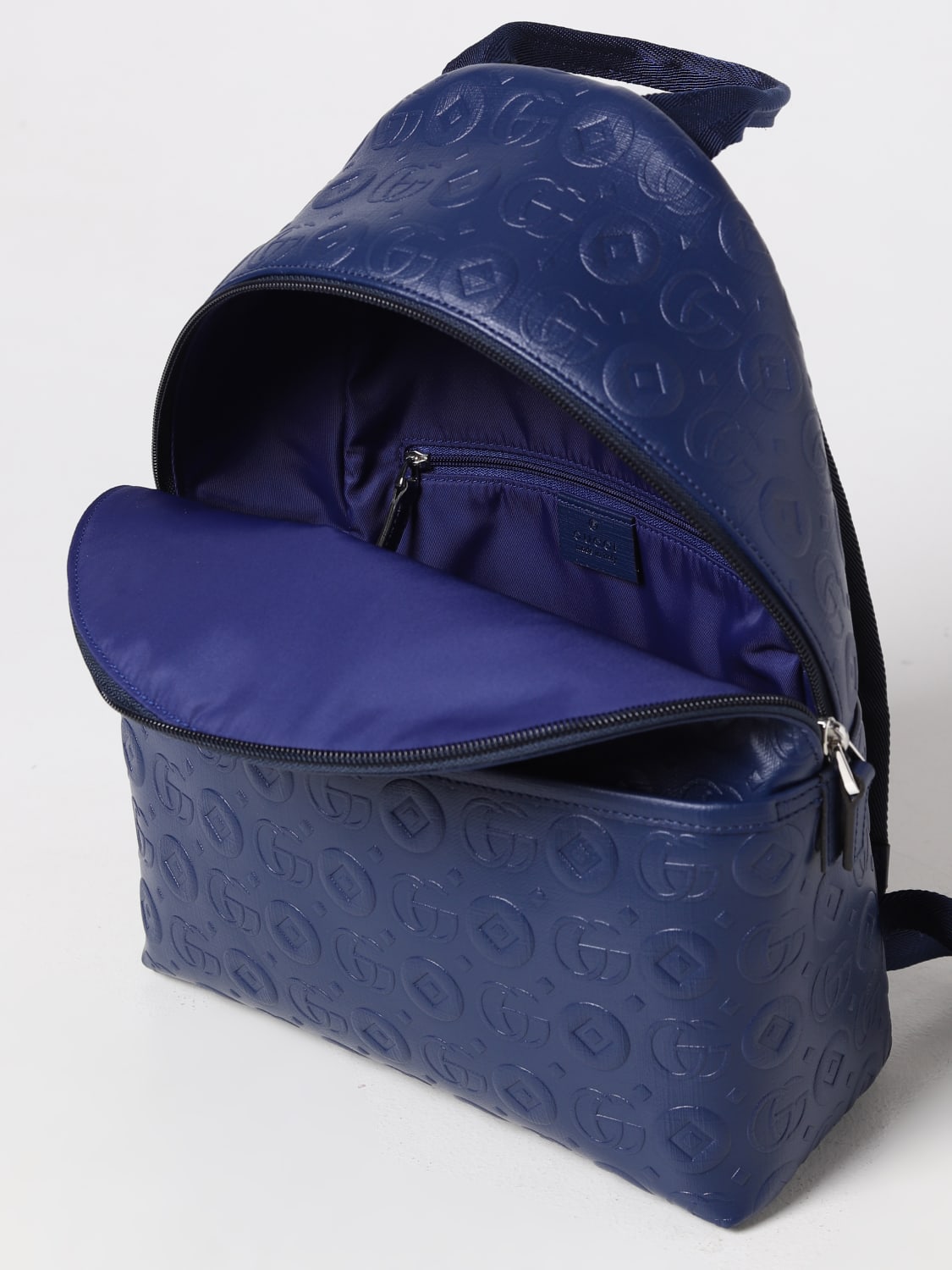 GUCCI: backpack in coated fabric with all-over GG monogram - Blue