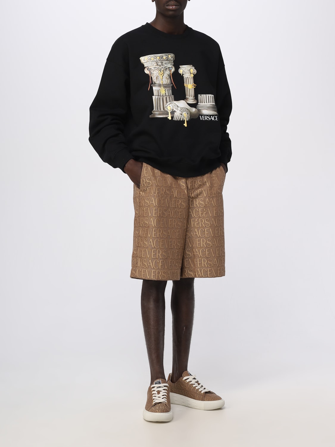 VERSACE: shorts in cotton blend with all over logo - Sand | Versace ...