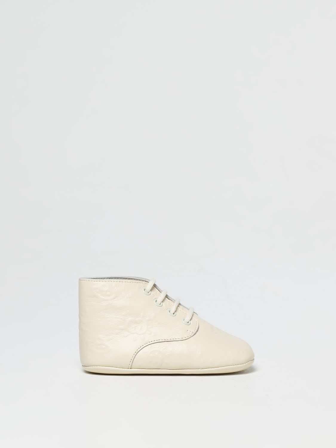 GUCCI: ankle boots in nappa with embossed monogram - White