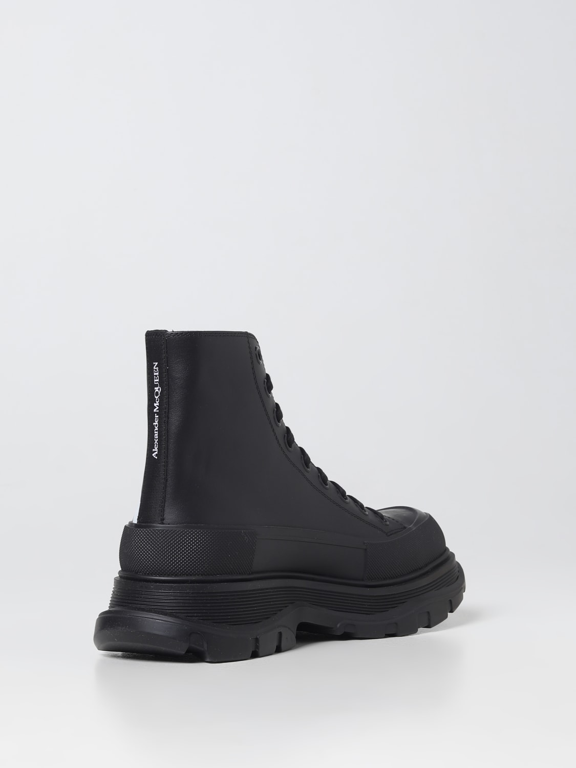 ALEXANDER MCQUEEN: Tread Slick leather boots with printed logo - Black | Alexander  McQueen boots 711109WIAT6 online at GIGLIO.COM