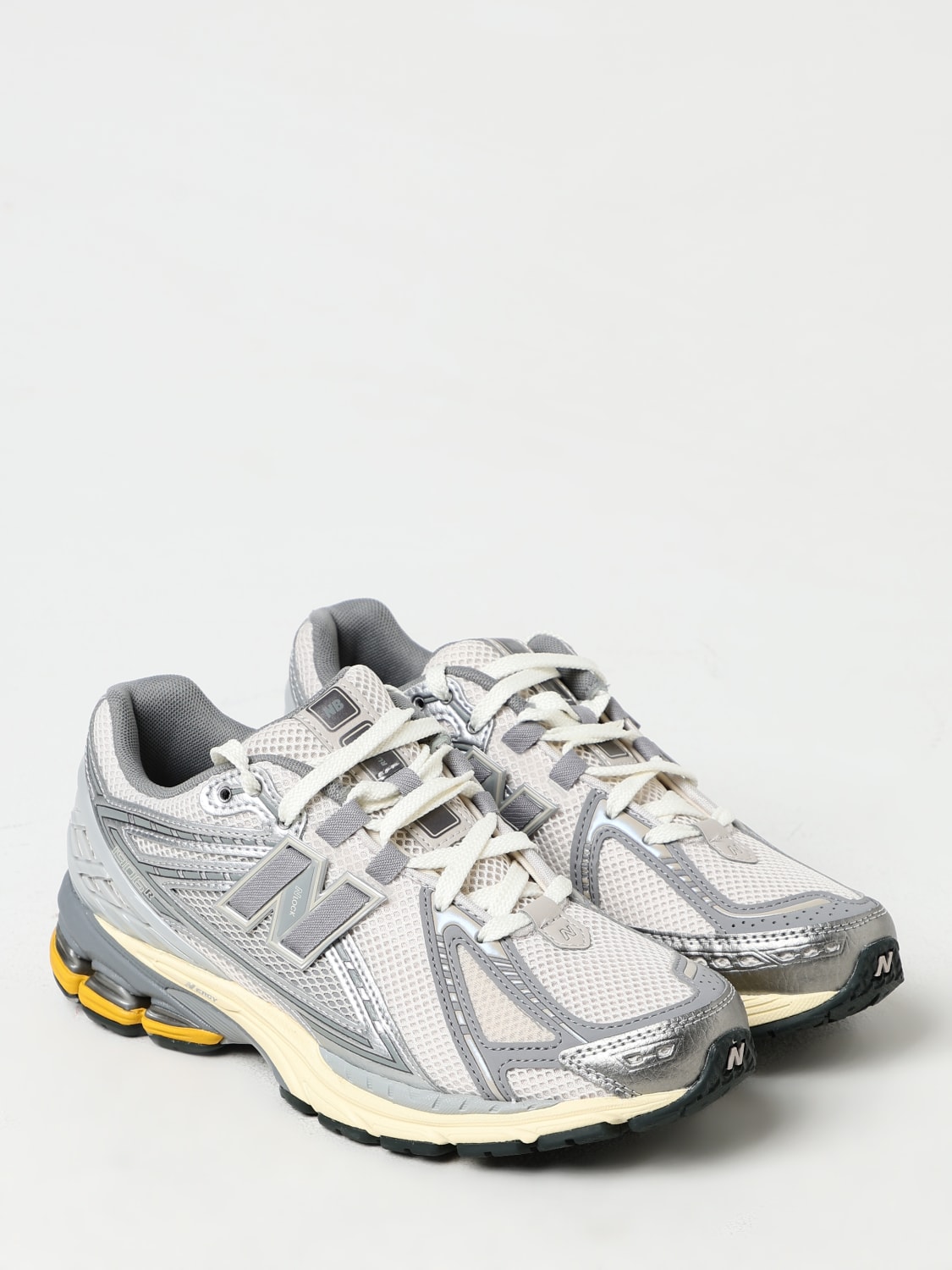 New balance hombre plata online