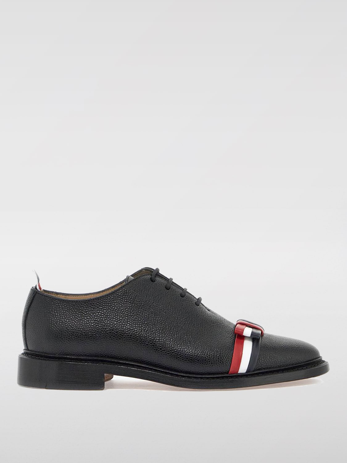 Giglio Derby Thom Browne in pelle a grana con fiocco Flag