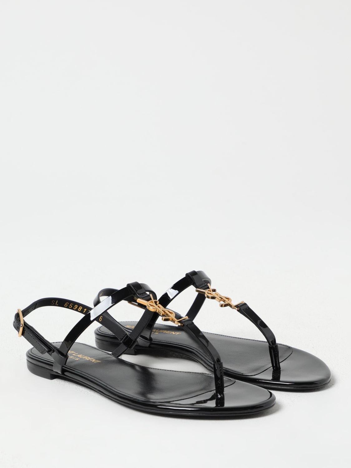 シューズ・サンダルその他 SAINT LAURENT Woman Flat sandals Black 659817B8IKK 1000 Cassandra sandals in patent leather | Saint Laurent | YSL US